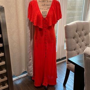 In great used condition, a summer orange Free People dress